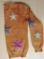 Suéter estrellas metálicas